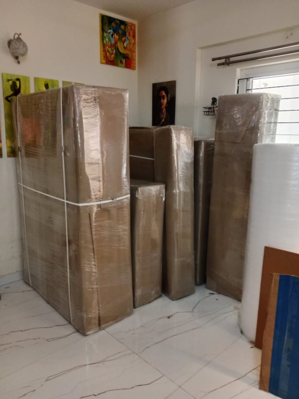 Wrapped wardrobes and furniture protected for moving